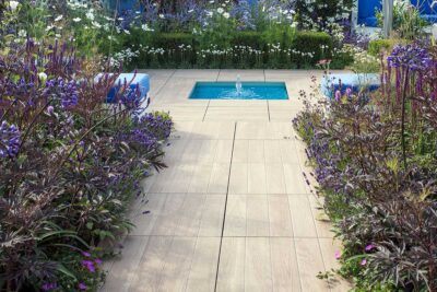 porcelain paving with a small water feature in a modern garden