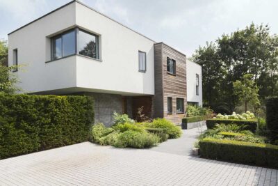 modern home with a contemporary garden and driveway