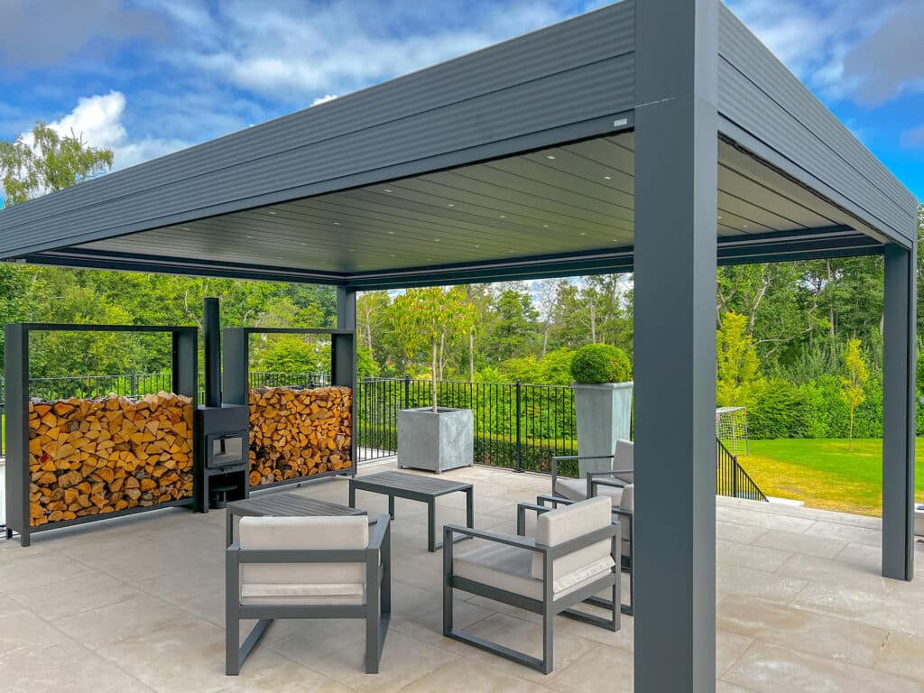 Aluminium pergola with outside fireplace, log store and luxury garden furniture