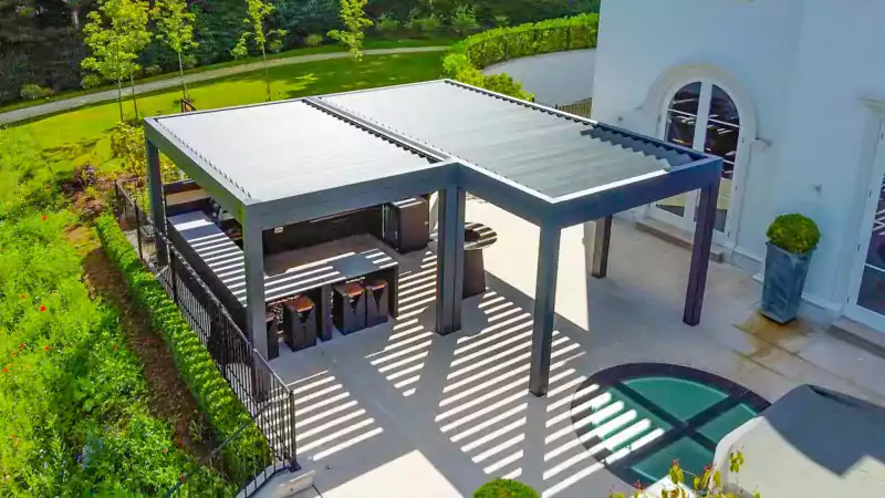 large bespoke aluminium pergola taken form the air showing a large garden patio and outside kitchen