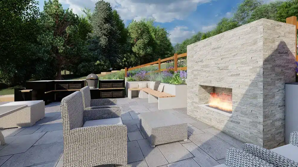 an entertaining garden space with a large garden fire place that is clad in stone. In the background there is a large outside kitchen and by the fireplace there are two luxury chairs, and a small coffee table. Designed by Luxurys 